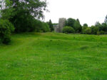 earthworks with church behind