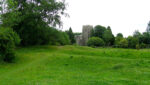 earthworks with church behind